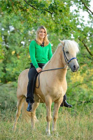 simsearch:853-06306120,k - Teenage girl sitting on horse Stock Photo - Rights-Managed, Code: 853-06306085