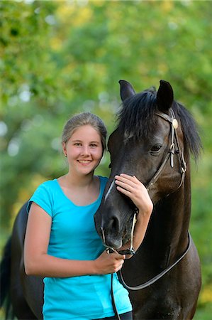 simsearch:853-06306120,k - Smiling girl with horse Stock Photo - Rights-Managed, Code: 853-06306083