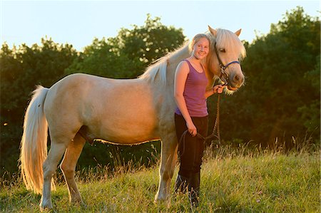 simsearch:853-06306120,k - Smiling girl with horse on meadow Stock Photo - Rights-Managed, Code: 853-06306126