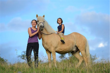 simsearch:853-06306120,k - Two girls with horse on meadow Stock Photo - Rights-Managed, Code: 853-06306122