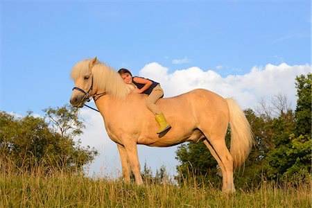 simsearch:853-06306120,k - Girl sitting on horse Stock Photo - Rights-Managed, Code: 853-06306136