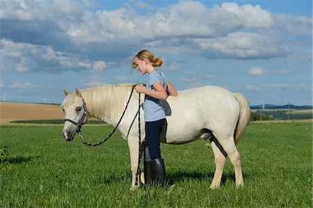 simsearch:853-06306120,k - Girl with horse on meadow Stock Photo - Rights-Managed, Code: 853-06306139