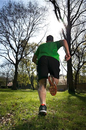 Man running over meadow Stock Photo - Rights-Managed, Code: 853-06441357