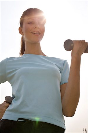 simsearch:853-03616708,k - Young woman with dumbbells Stock Photo - Rights-Managed, Code: 853-06441483