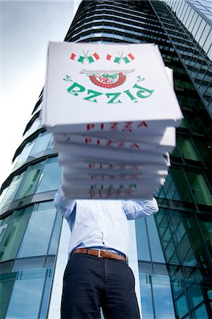 Man with pizza boxes in front of his face Stock Photo - Rights-Managed, Code: 853-06441569