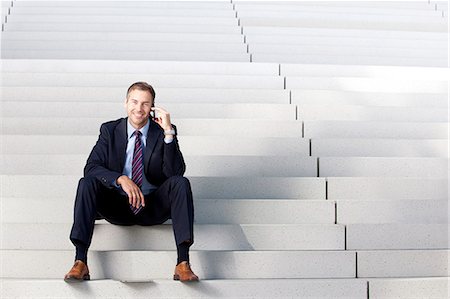 Businessman on the phone on stairs Stock Photo - Rights-Managed, Code: 853-06441717