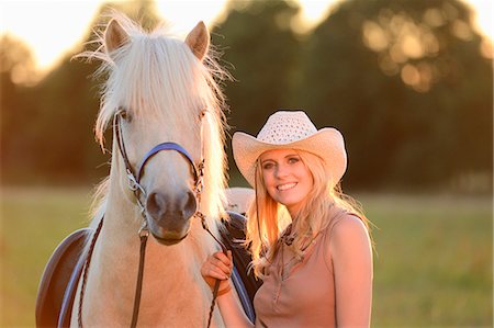 simsearch:853-06306120,k - Smiling woman with horse on meadow, portrait Stock Photo - Rights-Managed, Code: 853-06442125