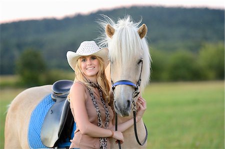 simsearch:853-06306120,k - Smiling woman with horse on meadow Stock Photo - Rights-Managed, Code: 853-06442127
