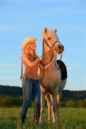 simsearch:853-06306120,k - Smiling woman with horse on meadow Stock Photo - Rights-Managed, Code: 853-06442161