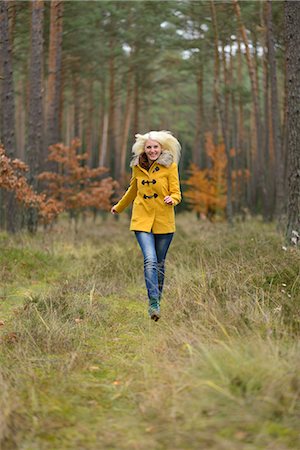 running in the fall - Happy blond young woman in forest Stock Photo - Rights-Managed, Code: 853-06442271