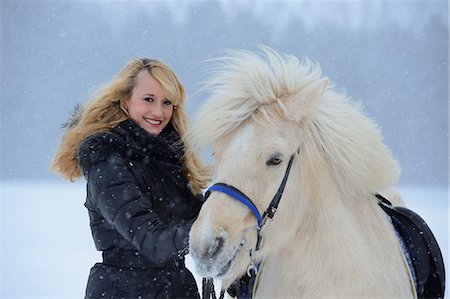 Young woman with horse in snow, Upper Palatinate, Germany, Europe Stock Photo - Rights-Managed, Code: 853-06623178