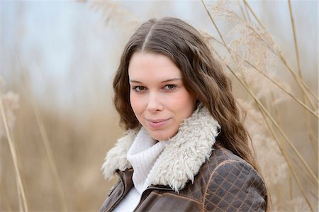 Smiling young woman outdoors, portrait Stock Photo - Rights-Managed, Code: 853-06893184