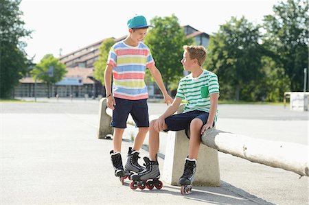 pre teen rollerblading - Two boys with in-line skates on a sports place Stock Photo - Rights-Managed, Code: 853-07148595