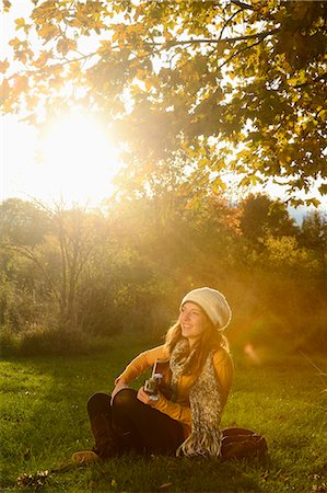 Smiling young woman playing guitar in autumn Stock Photo - Rights-Managed, Code: 853-07241900