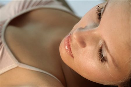 blonde woman lying on a bed Stock Photo - Rights-Managed, Code: 853-02914715