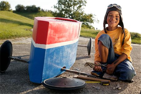 Boy reparing soap box Stock Photo - Rights-Managed, Code: 853-02913704