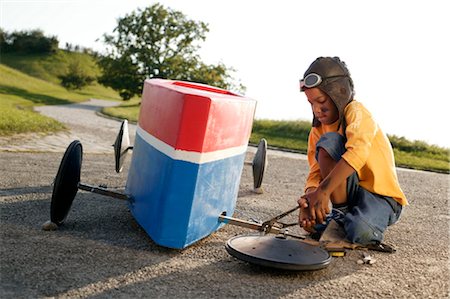 Boy reparing soap box Stock Photo - Rights-Managed, Code: 853-02913705