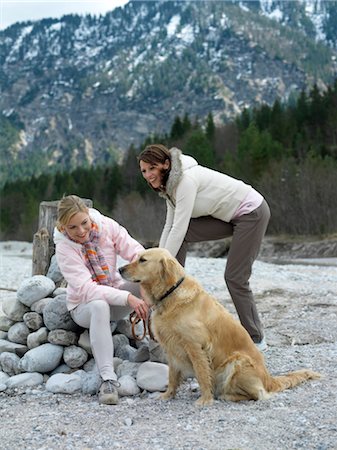 Two women with dog at lake Stock Photo - Rights-Managed, Code: 853-02913776