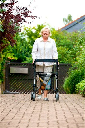 relieved person happy - Senior woman with walking frame making purchases Stock Photo - Rights-Managed, Code: 853-03616983