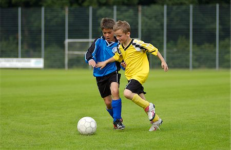 Two boys playing football Stock Photo - Rights-Managed, Code: 853-03776295