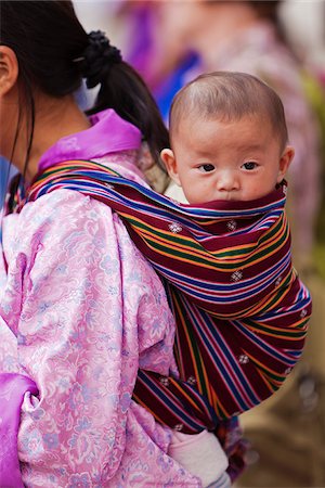 Baby wrapped in traditional Bhutanese woven fabric at Trashi Chhoe Dzong. Stock Photo - Rights-Managed, Code: 862-05996917