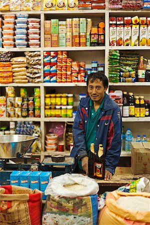 A shopkeeper in a general store in Thimphu. Stock Photo - Rights-Managed, Code: 862-05997046