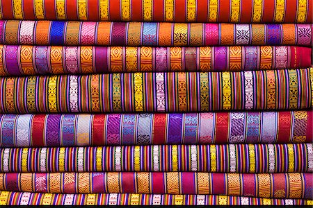 Bhutanese fabrics stacked up in a shop, Thimphu. Stock Photo - Rights-Managed, Code: 862-05997047
