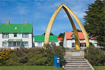 stanley - The whalebone arch, made from the jawbones of two blue whales presented by South Georgia whaling stations, was erected outside the Anglican cathedral in 1933 to commemorate a centenary of British rule. Stock Photo - Rights-Managed, Code: 862-05997624