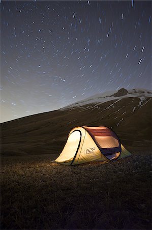 Italy, Umbria, Perugia district, Monti Sibillini NP, Norcia, Tent under the star. Startrail with Polaris in the center. Stock Photo - Rights-Managed, Code: 862-05998120