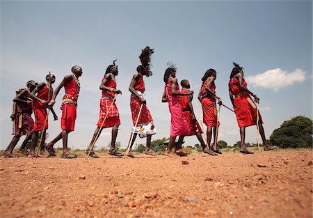 Maasai warriors perform a welcome dance at a lodge in the Masai Mara, Kenya. Stock Photo - Rights-Managed, Code: 862-05998384