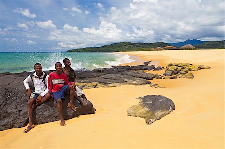 Africa, Sierra Leone, Freetown Peninsula, John Obey Beach. Boys sitting on rocks. Stock Photo - Rights-Managed, Code: 862-05999145