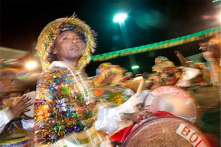 percussion instrument - South America, Brazil, Maranhao, Sao Luis, a costumed dancer at the Bumba Meu Boi festival in the Praca Aragao Stock Photo - Rights-Managed, Code: 862-06540893