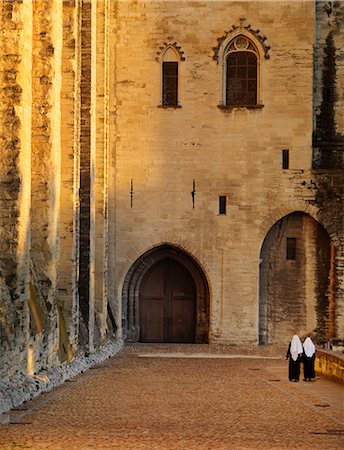 France, Provence, Avignon, Palais de Papes, Two nuns walking down cobbled road Stock Photo - Rights-Managed, Code: 862-06541505