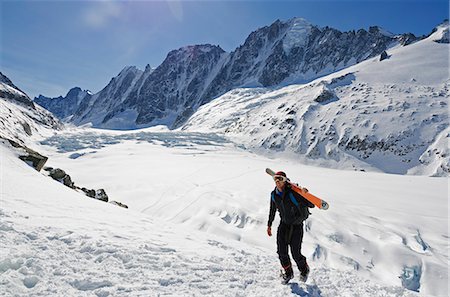 Europe, France, French Alps, Haute Savoie, Chamonix, skier carrying sis uphill in the Col du Passon off piste ski touring area MR Stock Photo - Rights-Managed, Code: 862-06541619
