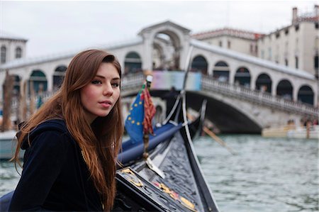 A young tourist enjoying the sights of Venice, with the Rialto Bridge in the background, Italy Stock Photo - Rights-Managed, Code: 862-06542161