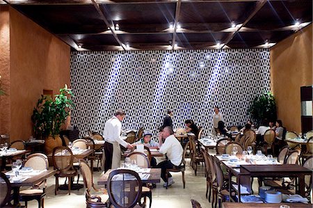 fine dining restaurant - South America, Brazil, Sao Paulo, Alex Attala dining in his award winning Dalva e Dito restaurant in Jardins. The tiles on the back wall were the last work by artist Athos Bulcao Stock Photo - Rights-Managed, Code: 862-06676095