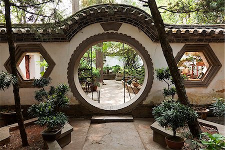 China, Yunnan, Tonghai. Moon gate at the Taoist temple gardens in Xiushan Mountain Park in Tonghai. Stock Photo - Rights-Managed, Code: 862-06676248