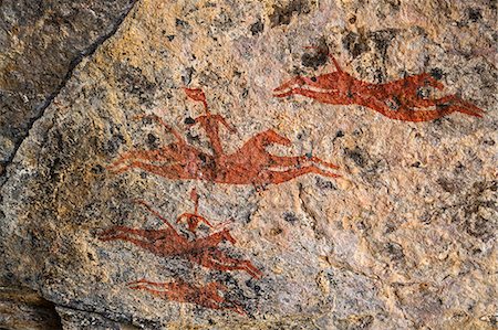 Chad, Wadi Archei, Ennedi, Sahara.  An ancient painting of galloping horses and riders estimated to be more than 2,000 years old. Stock Photo - Rights-Managed, Code: 862-06676524