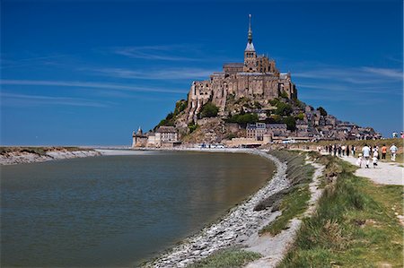 simsearch:862-06676770,k - Mont Saint Michel and its connection to the mainland via a tidal causeway with the River Couesnon on the left at high tide, Le Mont Saint Michel, Basse Normandie, France. Stock Photo - Rights-Managed, Code: 862-06676776