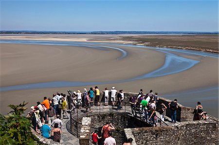 simsearch:862-06676770,k - Overview of the  ramparts of Mont Saint Michel and the tidal flats in the English Channel viewed from the mid level steps of Mont Saint Michel, Le Mont Saint Michel, Basse Normandie, France. Stock Photo - Rights-Managed, Code: 862-06676799