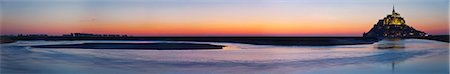 simsearch:862-06676770,k - Mont Saint Michel and its connection to the mainland via a tidal causeway with the River Couesnon on the left at low tide at sunset, Le Mont Saint Michel, Basse Normandie, France. Stock Photo - Rights-Managed, Code: 862-06676791