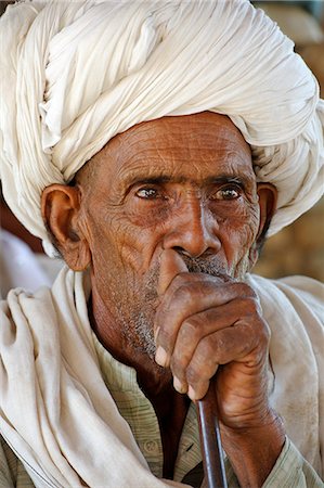 India, Rajasthan, Ajabgarh. A turbanned village man smokes a long pipe. Stock Photo - Rights-Managed, Code: 862-06676830