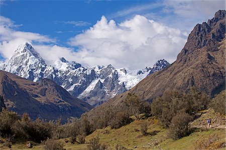 South America, Peru, Ancash, Cordillera Blanca. hiker with backpack walking on the Santa Cruz trek in Huascaran National Park, with the Quebrada Santacruz and the Taulliraju snowfields in the background Stock Photo - Rights-Managed, Code: 862-06677296