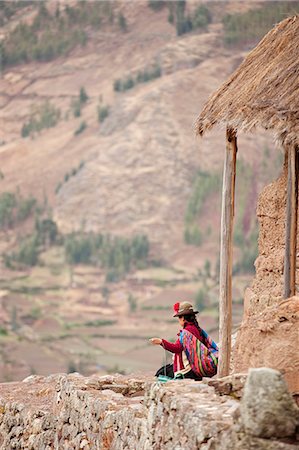 South America, Peru, Cusco, Sacred Valley, Pisac. A Quechua woman in a montera hat and with a Keperina shawl looks out over the Sacred Valley from the hills above Pisac Stock Photo - Rights-Managed, Code: 862-06677327