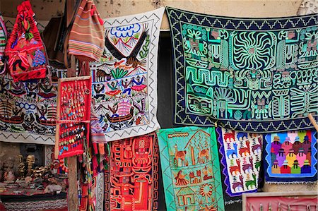 simsearch:862-06677365,k - South America, Peru, Cusco, Sacred Valley, Ollantaytambo. A tourist shop selling woolen clothing ibased on Andean and Shipibo designs Stock Photo - Rights-Managed, Code: 862-06677351