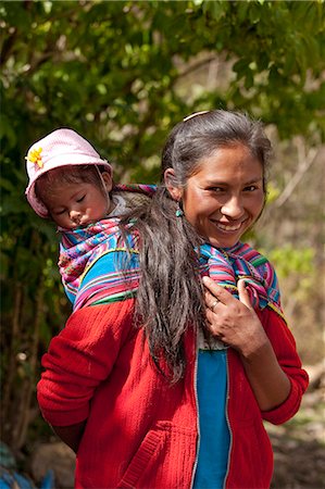 peruvian children - South America, Peru, Cusco, Yanama. A Quechua woman from Yanama village in the high Andes with a baby wrapped in a Keperina shawl Stock Photo - Rights-Managed, Code: 862-06677396