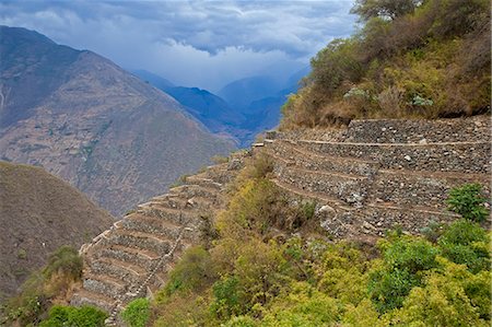 simsearch:862-06677365,k - South America, Peru, Cusco, Choquequirao. Threatening clouds over agricultural terraces at the Inca city of Choquequirao built by Tupac Inca Yupanqui and Huayna Capac and situated above the Apurimac valley with mountains of the Salkantay range Stock Photo - Rights-Managed, Code: 862-06677407