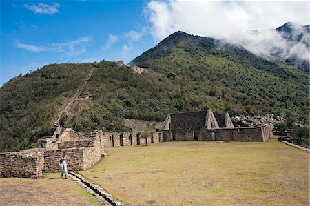 simsearch:862-06677365,k - South America, Peru, Cusco, Choquequirao.  A hiker on the plaza principal and wasi houses at the Inca city of Choquequirao built by Tupac Inca Yupanqui and Huayna Capac and situated above the Apurimac valley with mountains of the Salkantay range Stock Photo - Rights-Managed, Code: 862-06677408