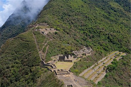 simsearch:862-06677365,k - South America, Peru, Cusco, Choquequirao. Terraces, plazas and buildings at the Inca city of Choquequirao built by Tupac Inca Yupanqui and Huayna Capac and situated above the Apurimac valley with mountains of the Salkantay range with hikers in the foreground Stock Photo - Rights-Managed, Code: 862-06677412
