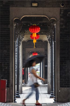 Woman walking along corridor at Chen Clan Academy, Guangzhou, Guangdong, China Stock Photo - Rights-Managed, Code: 862-06825166